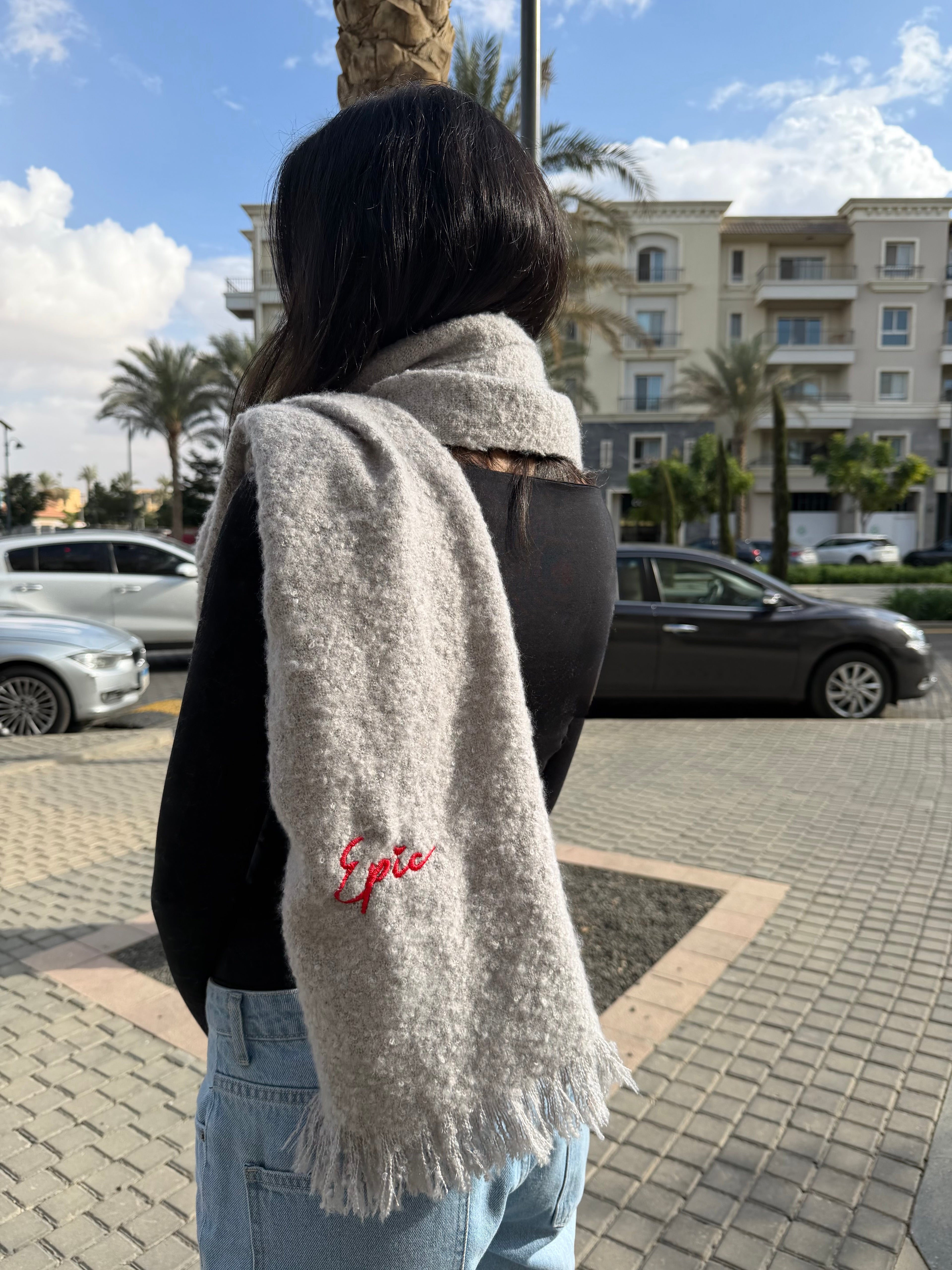 The scarf in light grey